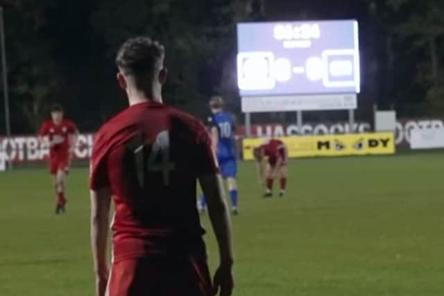 Lewis Croal adds the ninth Hassocks goal whilst the Beacon scoreboard struggles to keep up