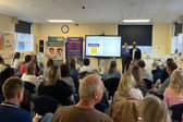 Catriona Neville and Charles Nduka, Consultant Plastic Surgeon at Queen Victoria Hospital and Founder of Facial Palsy UK, speaking at the Living with Facial Palsy event.