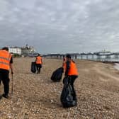 Offenders working to clear waste from Eastbourne beach.