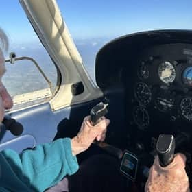 Elisabeth flying a plane at 99