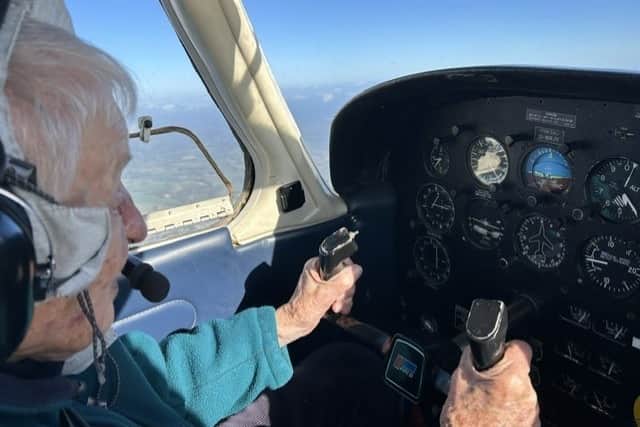 Elisabeth flying a plane at 99