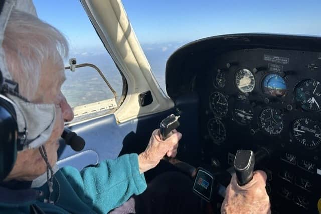Elisabeth flying a plane at 99