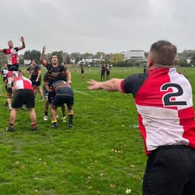 Stephen Cooper launches the ball