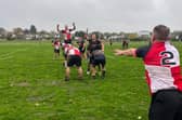 Stephen Cooper launches the ball