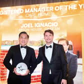 Louis Alexander presenting Joel Ignacio with his award