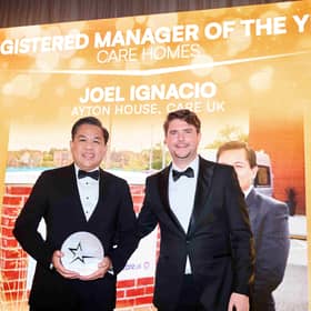 Louis Alexander presenting Joel Ignacio with his award