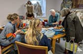 The 'Reuse' table at New Leaf, where residents learned different ways to give their clothing a new lease of life