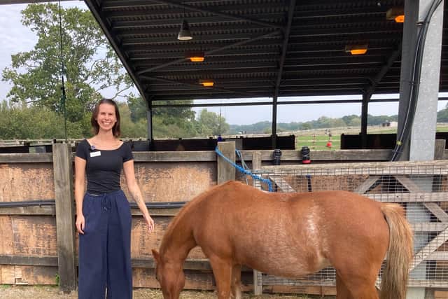 Miriam Dowding  outside the horse barn