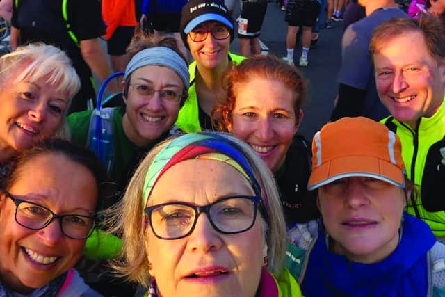Eight Hastings Runners are all smiles BEFORE the Beachy Head Marathon.