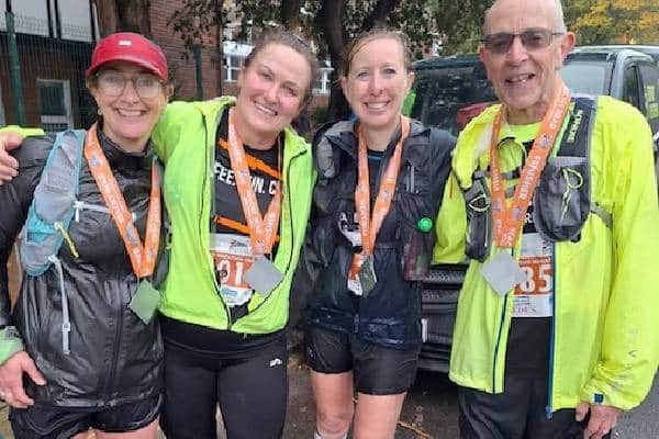 Hailsham's Annette Feakes, Graham Purdye and Maria Stewart proudly displaying their medals at the Beachy Head Marathon