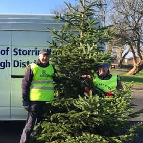 Rotarians Ken Collins & Mike Webster collecting Christmas trees.