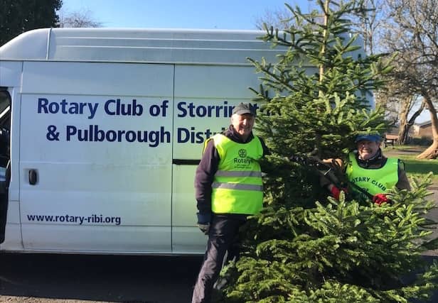 Rotarians Ken Collins & Mike Webster collecting Christmas trees.