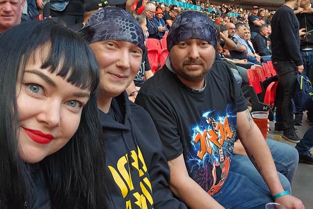 Marie, Carl and Dan waiting to see AC/DC at Wembley. Thanks to support from the hospice, Dan was able to tick off many items on his wishlist when his treatment ended, including seeing the iconic band.