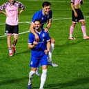 Tom Caplin celebrates Roffey's third goal with Jack Meeres.