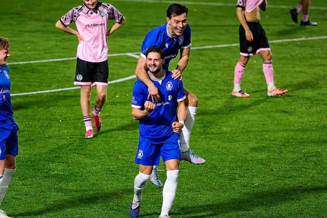 Tom Caplin celebrates Roffey's third goal with Jack Meeres.