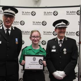 Eleanor Richardson with St John Ambulance County President Alex Ingham-Clark (Left) and County Commissioner Darren Owen (Right).
