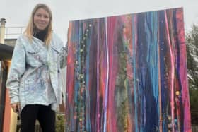 Artist Sophie Garwood with her painting Whispering Meadow (100 x 150cm, mixed media)