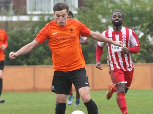 Mile Oak's Joe Benn in action against Redhill in the FA Vase on Saturday. Picture by Derek Martin