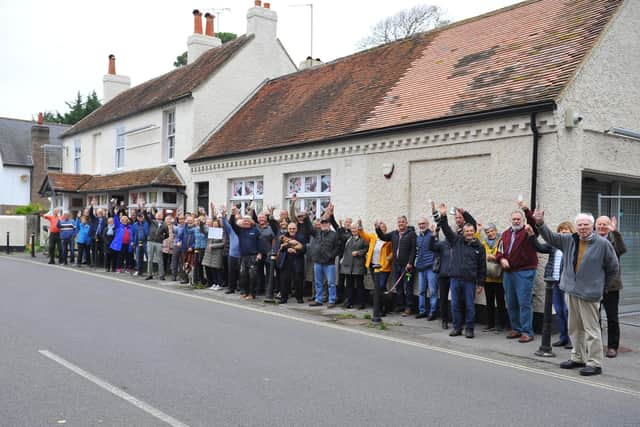 Residents gather outside the former Ship Inn in Aldwick