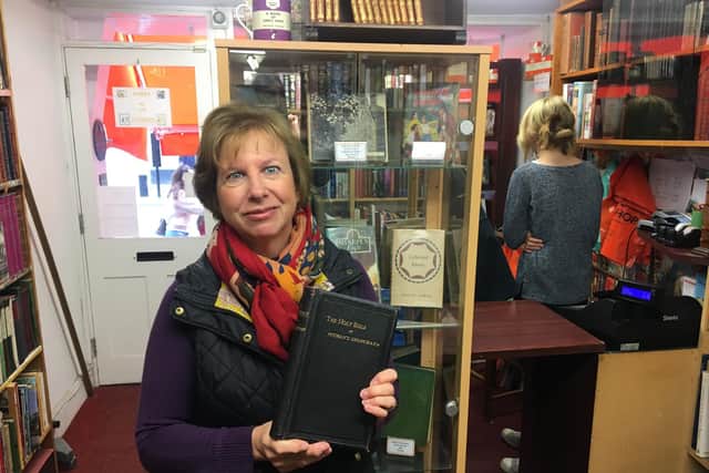 Lin Hearne at the Kim's Bookshop in Chichester with the book