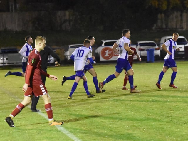 Nathan Cooper runs away after scoring.