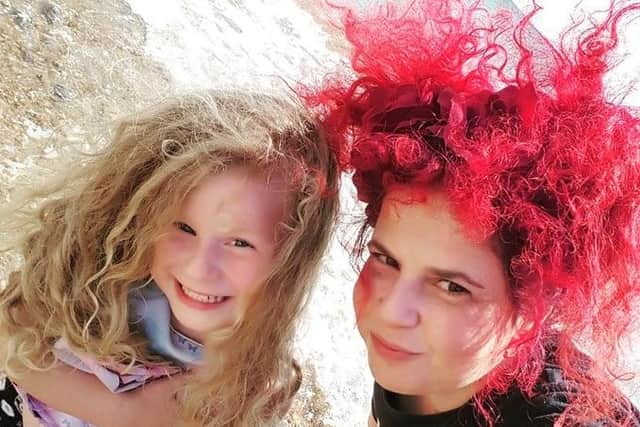 Candy Medusa, right, is raising awareness of plastic pollution