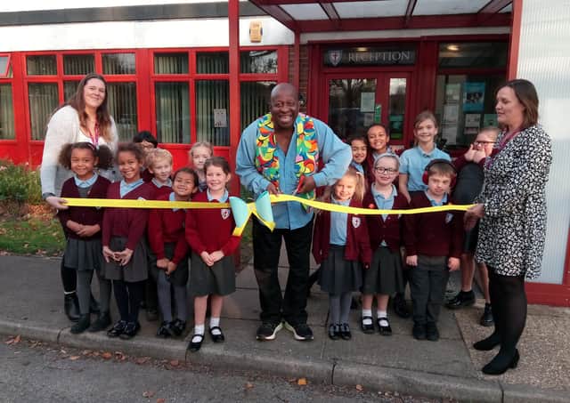 Dave Benson Phillips cuts the ribbon to officially open Heene Primary School as a certified Makaton Friendly provider, with teacher Sarah Chandler, left, head teacher Jo MacGovern and signing ambassadors