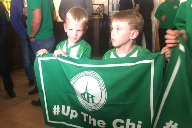 Two young Chi City fans ready for the draw and the TV cameras