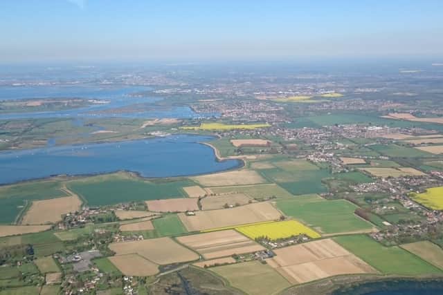 An aerial photograph of the top of Chichester Harbour and the A259 corridor