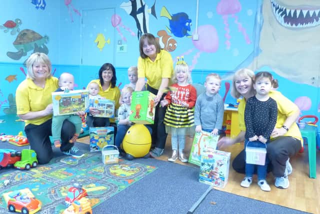 Staff and children at the Worthing Leisure Centre creche with the new toys
