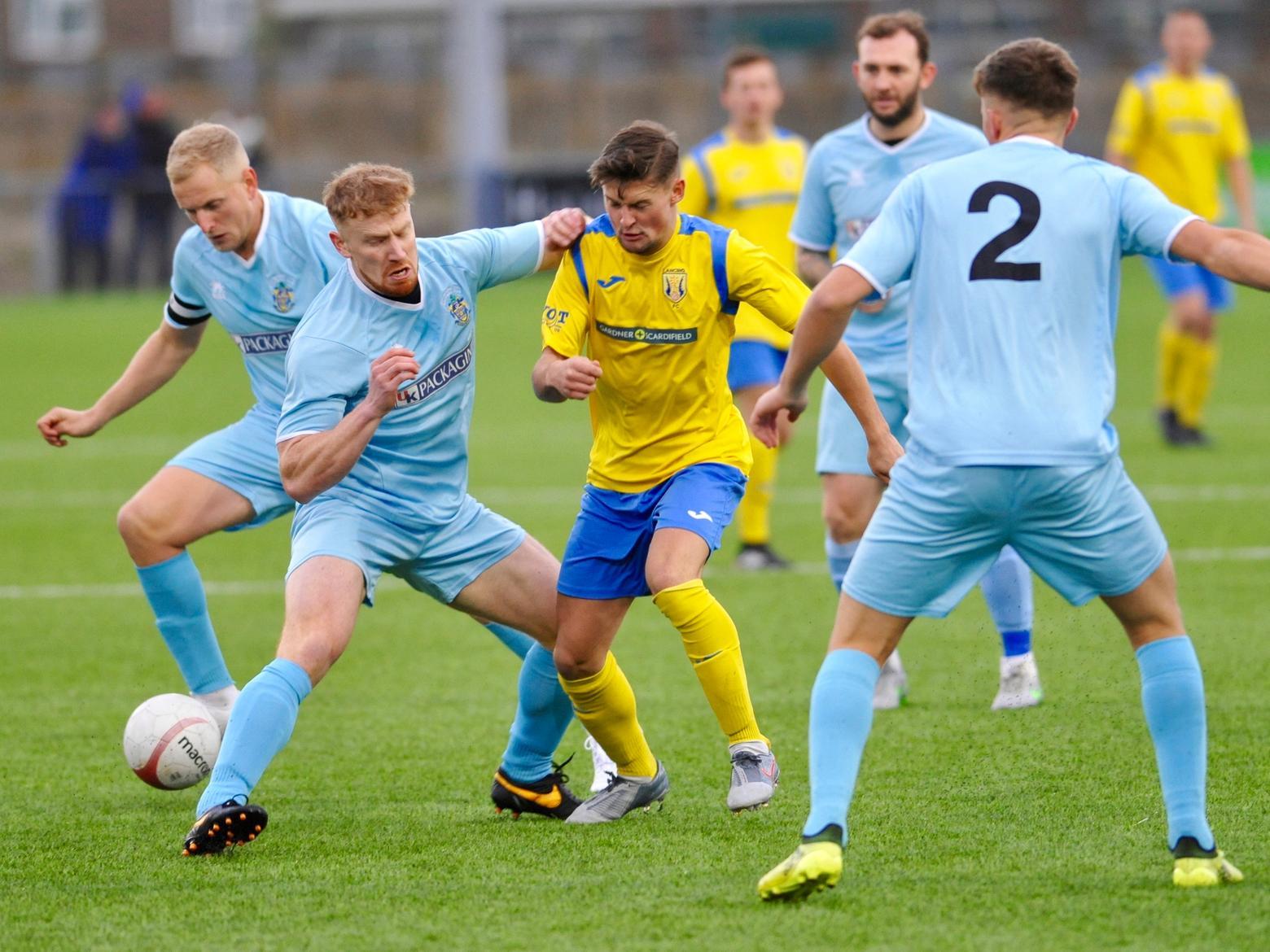 Action from Lancing v Eastbourne Town.
