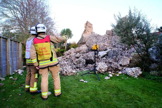 Fire crews investigating the collapsed wall in Lewes. Picture: Peter Cripps
