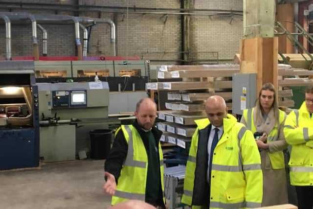 Sajid Javid being show some of the wood sold at Covers