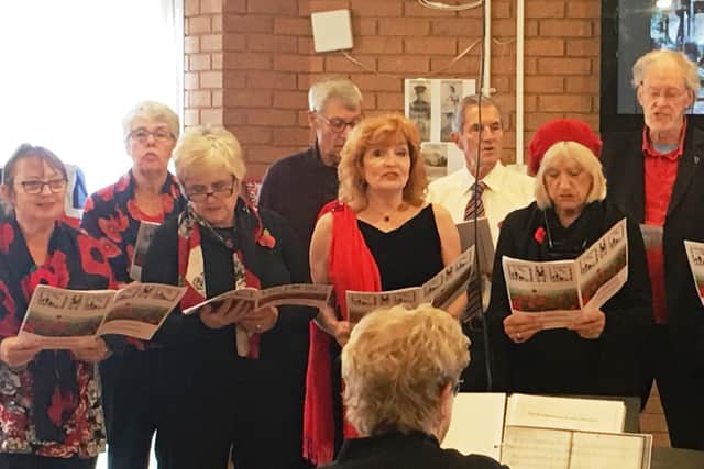 The Phoenix Singers opened and closed the club's Rememebrance service