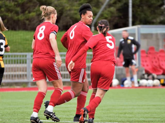 Rebecca Thompson-Agbro (middle) celebrates her goal at the weekend. Picture by OneRebelsView