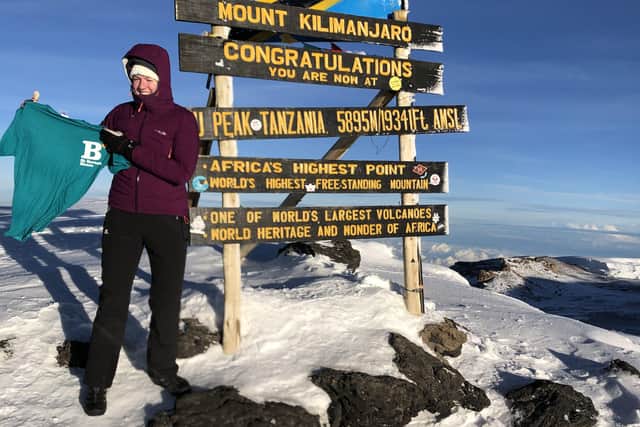 Chantal Cox reaches at the summit of Mount Kilimanjaro