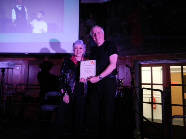 Nigel Bubloz accepts the award for best sound design on behalf of Jeff Woodford for Southwick Players' Dinner