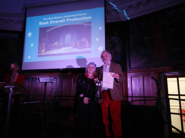 Mike Wells, director of Wick Theatre Company's Taking Sides, accepts the award for best overall production