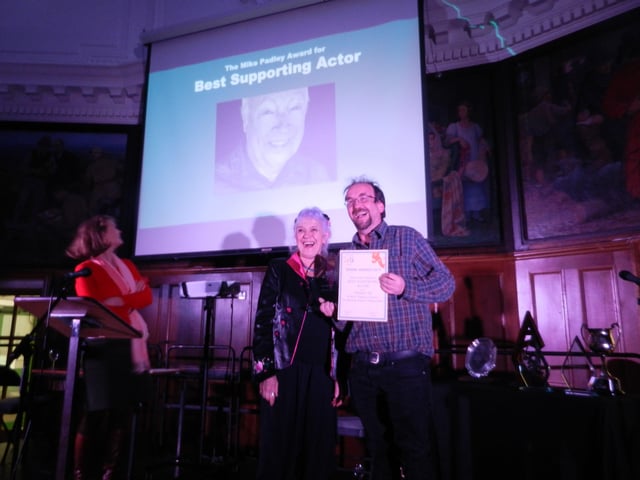John Garland accepts the award for best supporting actor on behalf of Graham Till, who played Helmuth Rode in Wick Theatre Company's Taking Sides