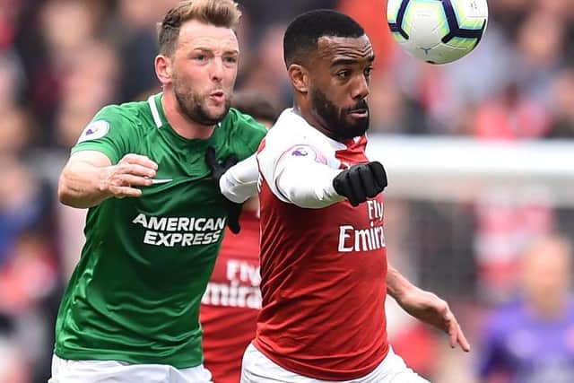 Brighton and Hove Albion midfielder Dale Stephens in action against Arsenal's Alexandre Lacazette last season