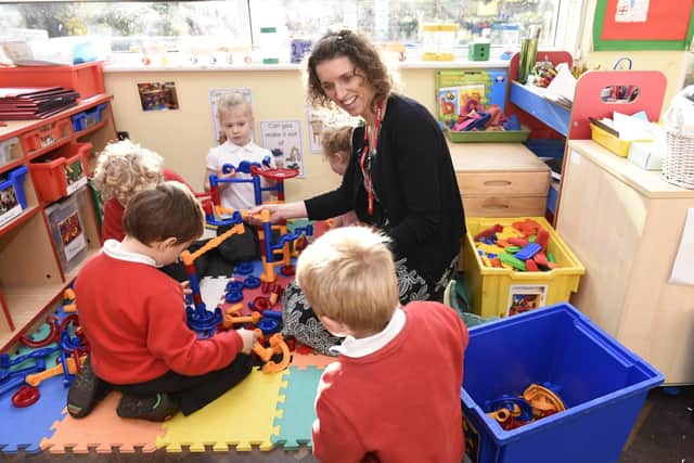 Ofsted Report  Rumboldswhyke School were given an inadequate Ofsted report and faced closure.  They have since improved and been given the thumbs up to their monitored action plan.    Pictured is teacher, Kirsty Roz with reception pupils.   Chichester, West Sussex.   Picture: Liz Pearce  04/12/2019  LP191930 SUS-190412-124051008