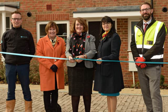 Horsham district councillor Tricia Youtan cuts the ribbon at the official opening of new homes near Horsham's Holbrook Club SUS-190512-150520001