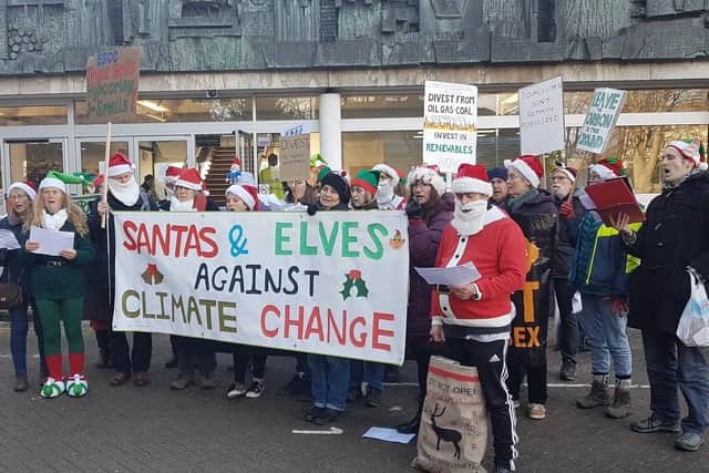 Santas and elves protesting outside County Hall in Lewes. Picture: Divest East Sussex