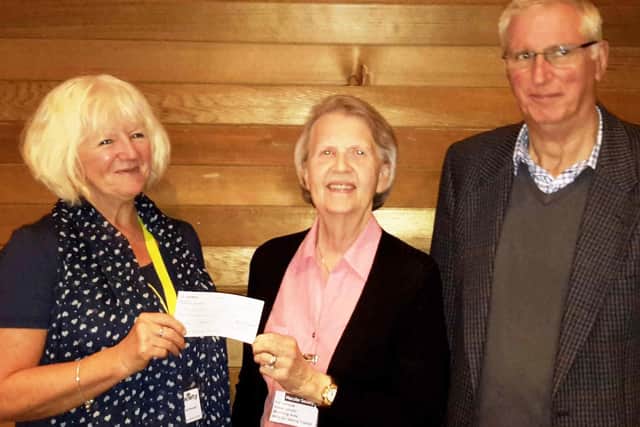 Macular Society regional manager Stella Black, left, accepts the cheque from Pat Clemow and Nick Le Mare