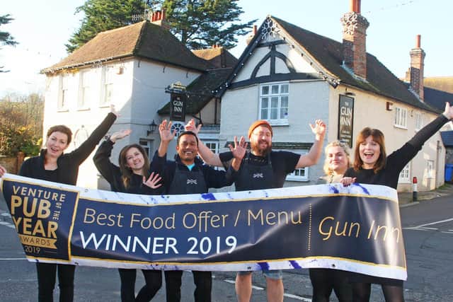 Sally Harris, manager, right, with the team outside The Gun Inn. Picture: Derek Martin DM19120349a