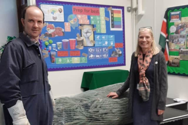 Michael Grant donating the Blue Spruce to Holy Cross Headteacher Cathy Dart