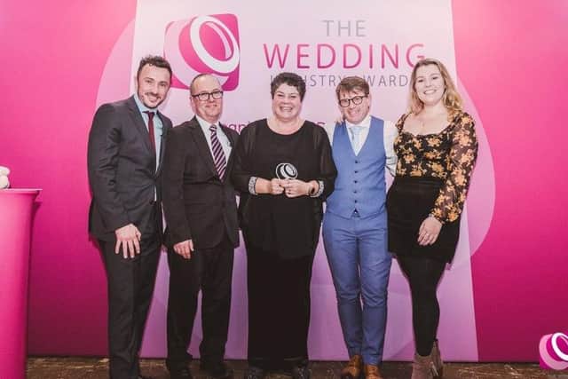 Amanda Millis, weddings and functions manager, with the team from Field Place Manor House & Barns accepting the award for best town or city wedding venue in the south east