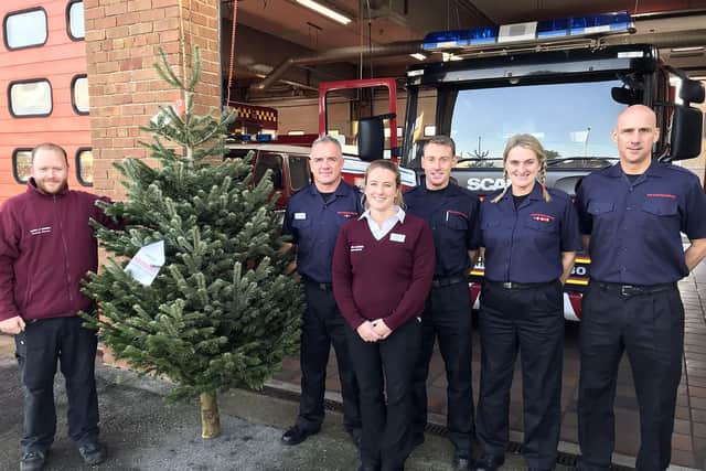 Shoreham firemen receiving their Christmas tree from Mayberry Garden Centre