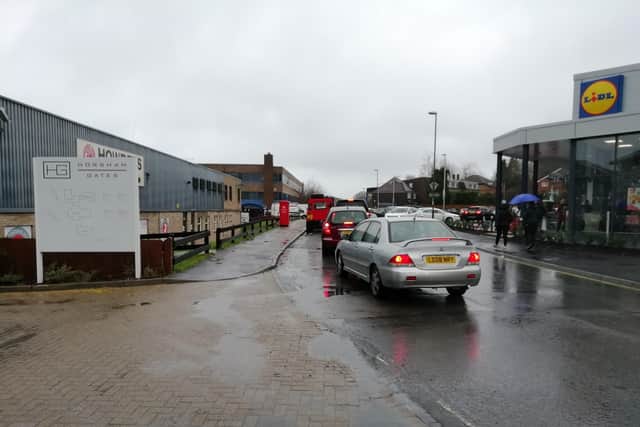 Traffic queueing to get into the new Horsham Lidl store SUS-191212-102423001