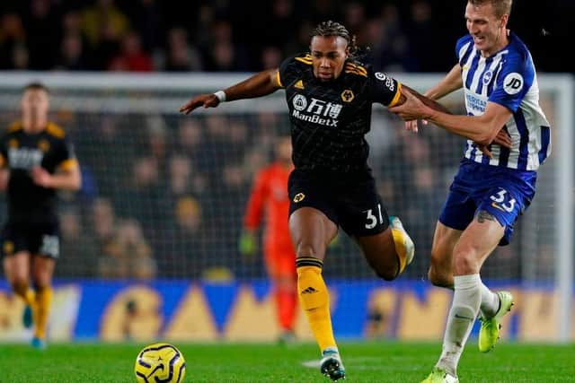 Brighton and Hove Albion defender Dan Burn coped pretty well with the threat from Wolves flyer Adama Traore